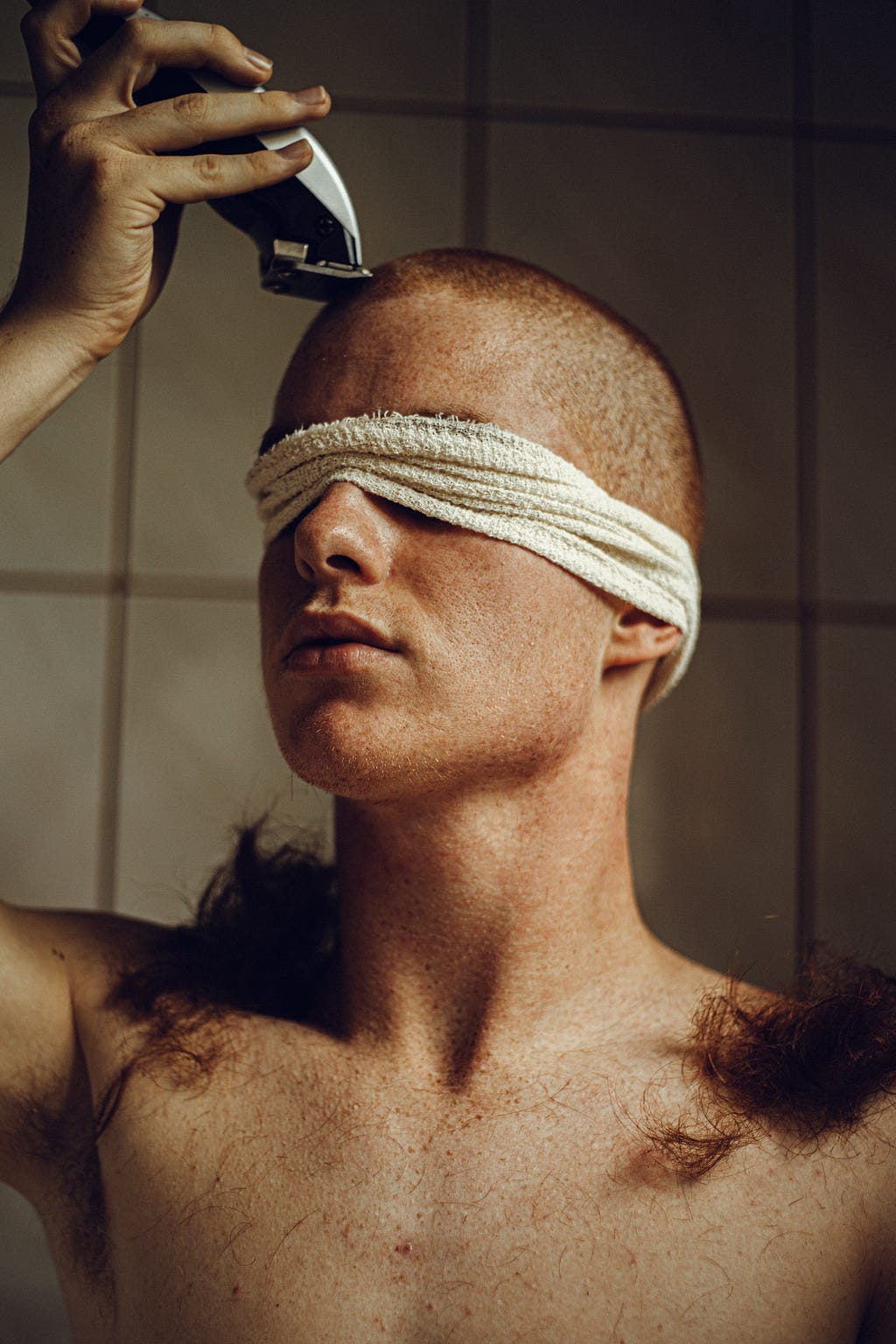 Trichotillomania or hair-pulling representation, man shaving his hair