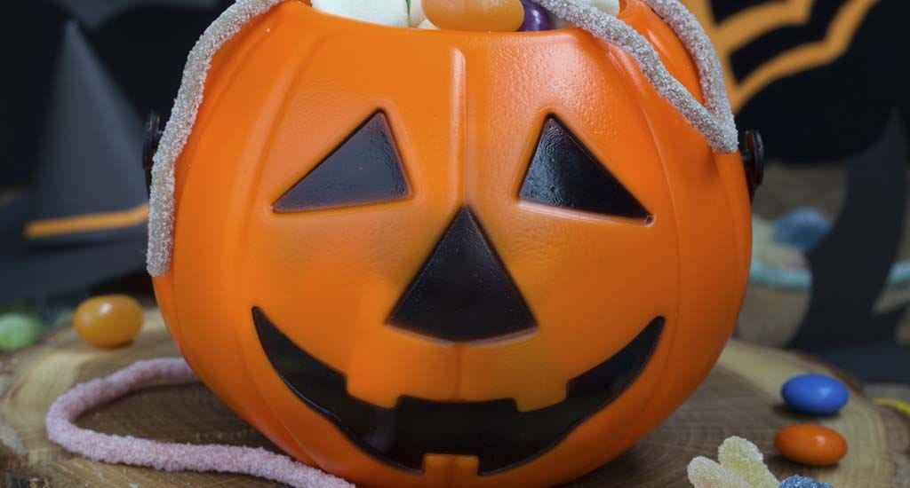 Jack o lantern full of Halloween candy