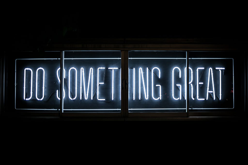 Neon sign with the text “Do something great”