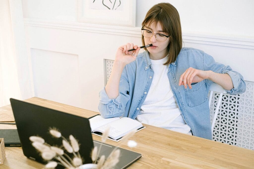 Woman Working in Home Office, thinking about whether fiverr is legit or a scam