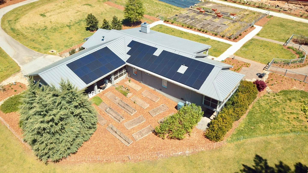 Top view of house with solar panels on the roof