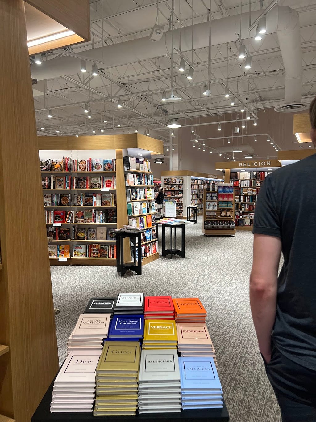 An image behind someone walking into the bookstacks in Barnes and Noble.