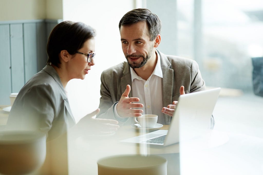 Business owners discussing their plans