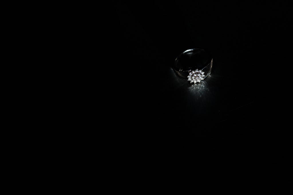 A diamond ring with its reflection