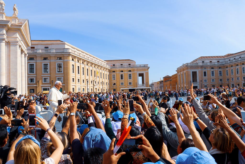 The pope, waving to an audience