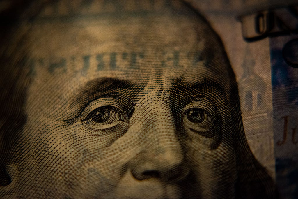Benjamin Franklin’s face on the $100 bill gazes at you representing how to make money in affiliate marketing