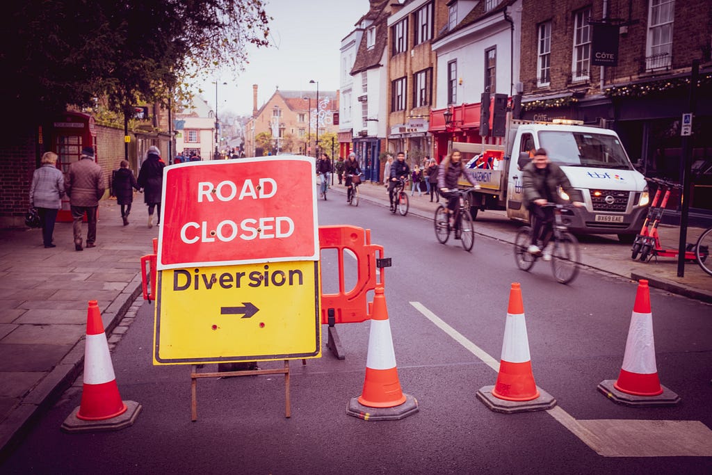 street with a sign saying “road closed, diversion”