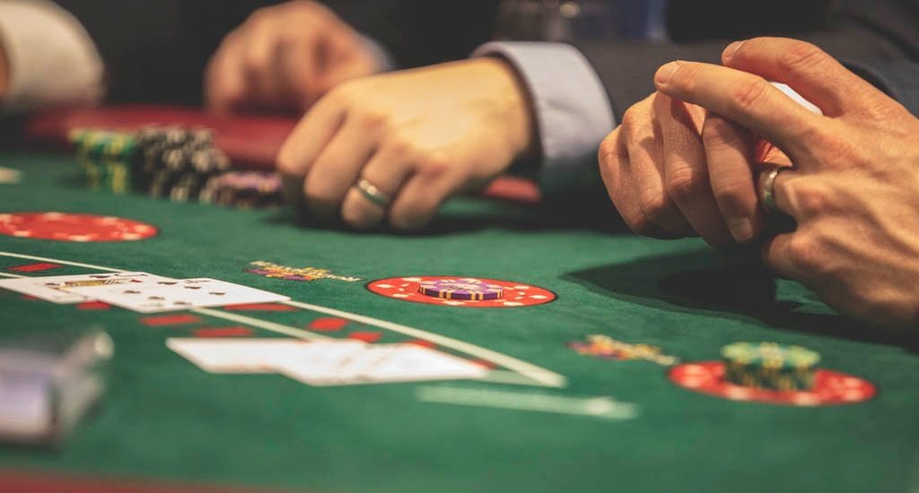 Businessmen gambling in casino