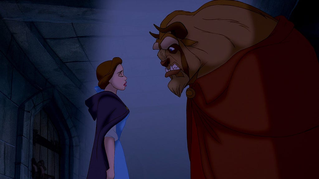 Belle stands in front of the Beast and promises she’ll stay forever.