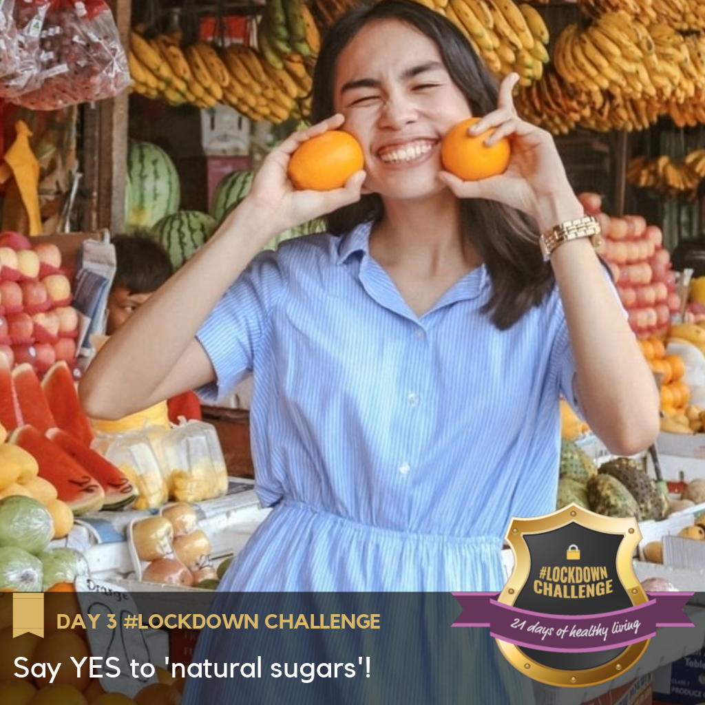 A girl with oranges in a fruit market