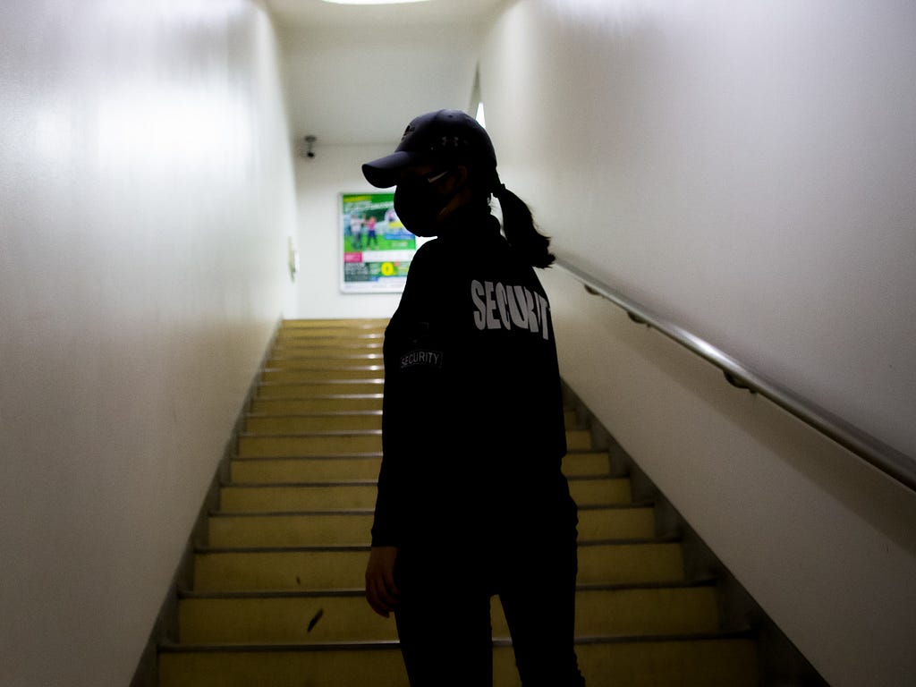 Stock photo of an event security guard in a stairwell