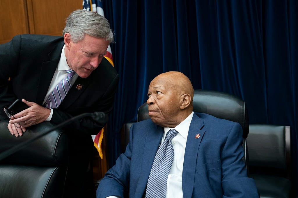 House Oversight and Reform Committee Chairman Elijah Cummings, D-Md., center, speaks with Rep. Mark Meadows, R-N.C.