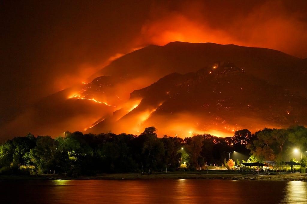 Wildfire ripping across a mountain.