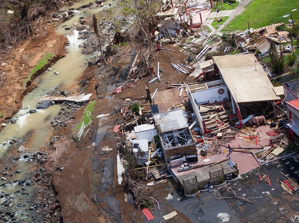 Aerial view of a damaged home in the mountainous area of Barranquitas, Puerto Rico, October 9, 2017. Photo by Andrea Booher/FEMA