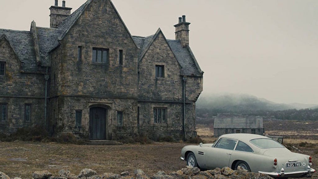Establishing shot for the finale to the film, Skyfall. The classic Bond car sits in the foreground to a misty stone cottage.