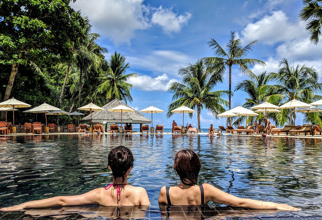 two women relax in a pool