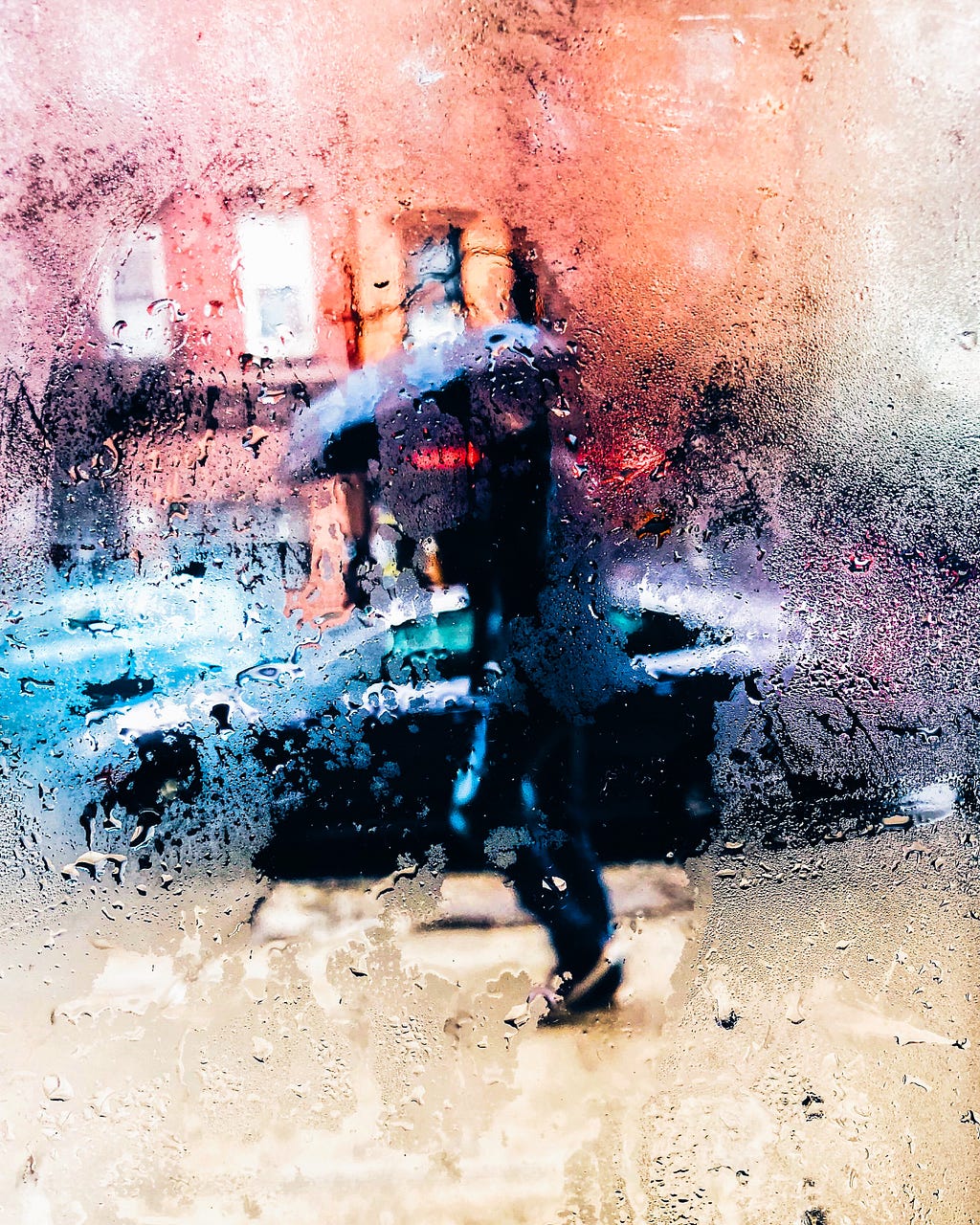 person in rain with an umbrella