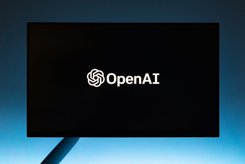 A computer screen displaying the Open AI logo