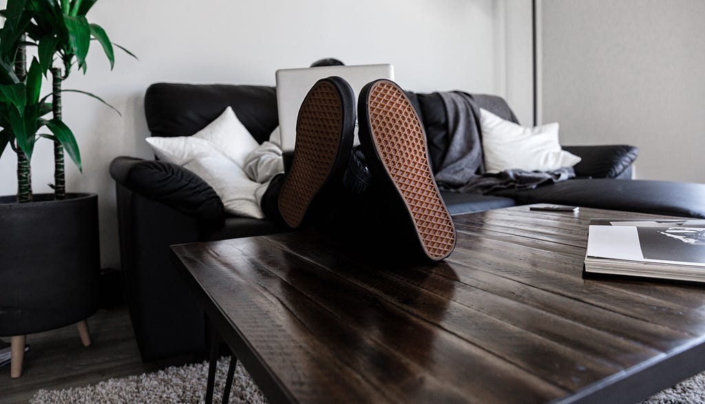 Businessman’s feet on a table