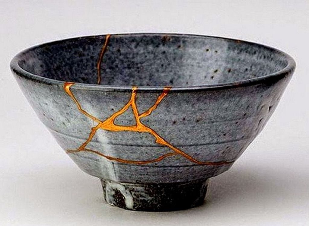 Broken vase filled with gold as in the Japanese practice of kintsugi.