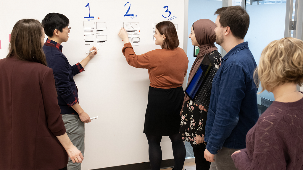 Design system team using the dot-voting approach to support design decision-making.