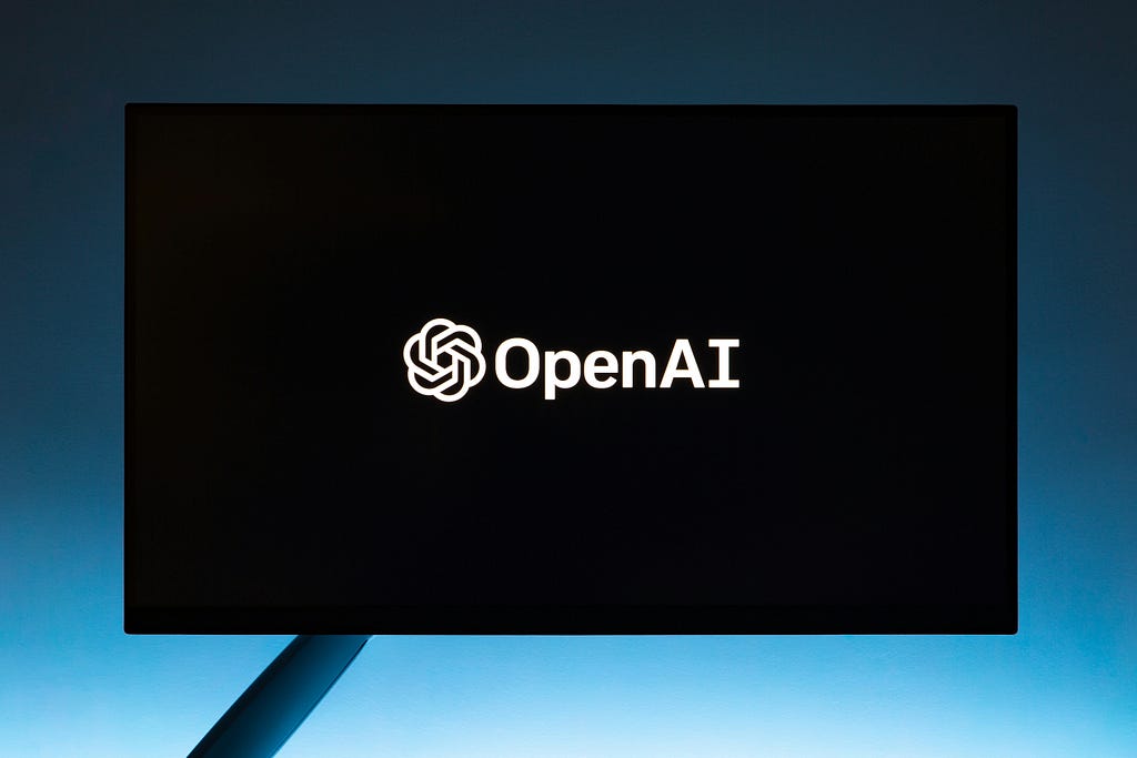 A black screen that says “OpenAI”