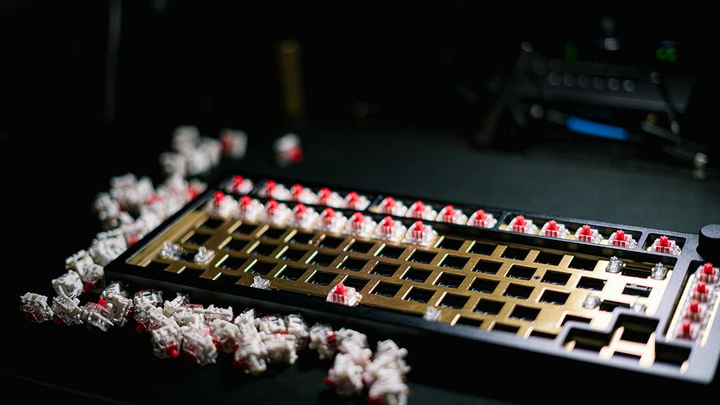 A photo showing empty mechanical keyboard with romoved keys and exposed switches