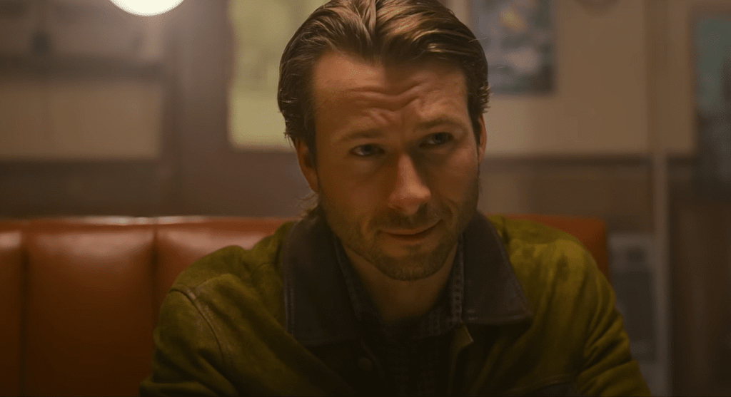 Glen Powell going undercover in Hit Man (2023). Credit: YouTube/Netflix