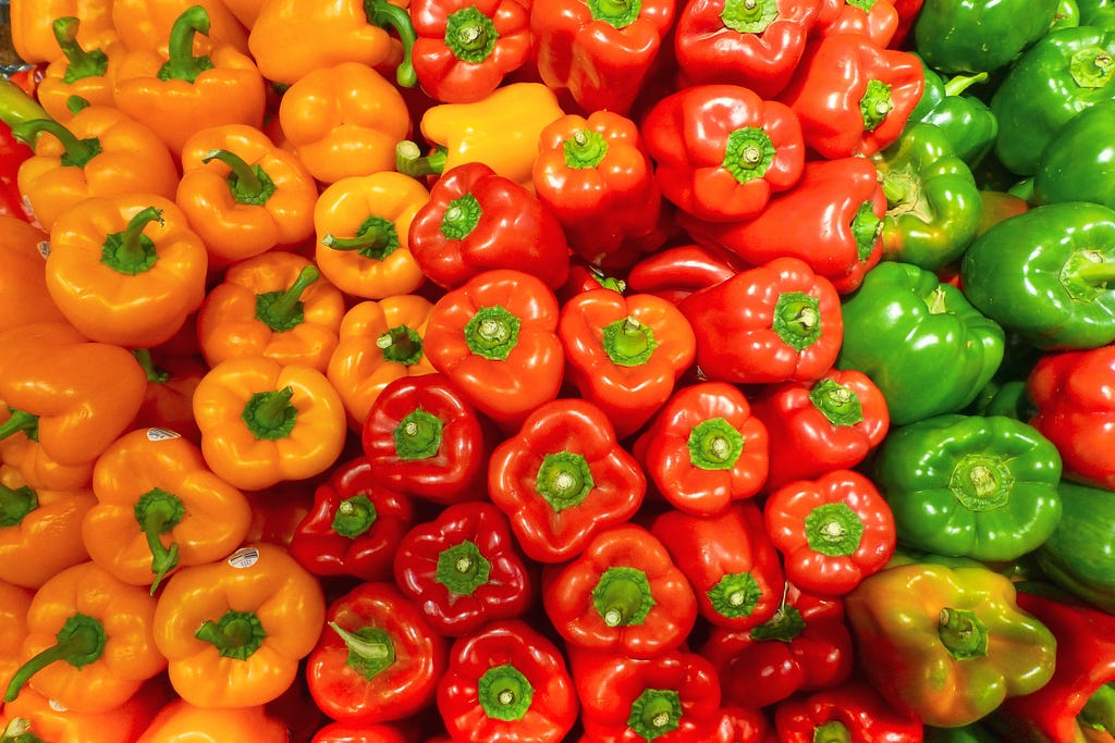 Orange, red, and green bell peppers