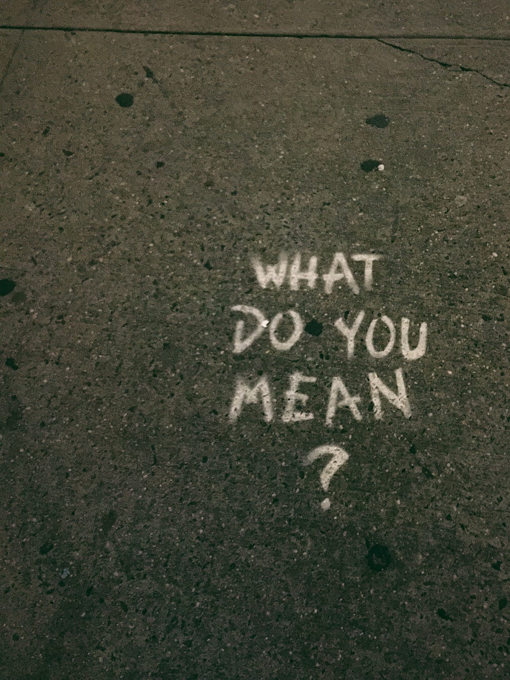 What do you mean? written on pavement