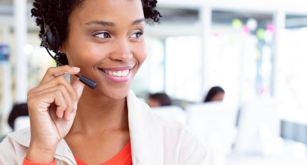 Happy business owner talking with customer over phone