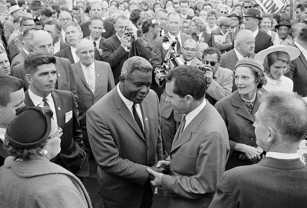 This photo from 1960 shows Jackie Robinson and Richard Nixon shaking hands at a Nixon campaign stop in New Jersey. Robinson helped Nixon campaign all across the country.