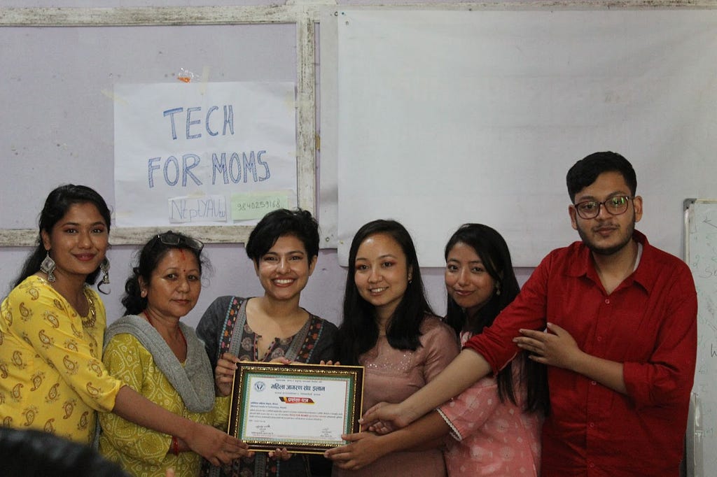 The Safer-I team accepting a certificate of gratitude from the organizers.