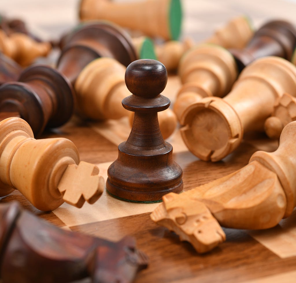 A single wooden chess coin which defeated every other one.