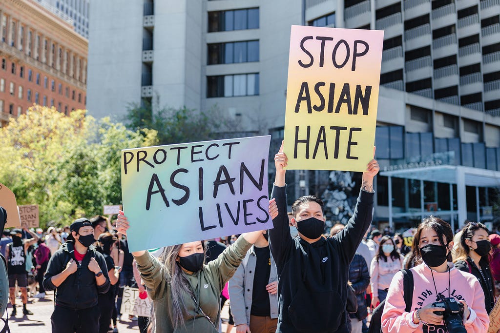 Protestors displayed signs that read “Stop Asian Hate” and “Protect Asian Lives.”