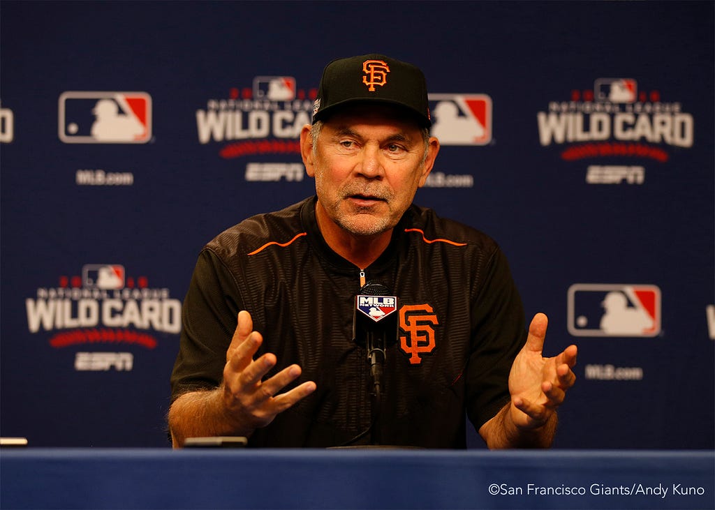 Bruce Bochy talks to the media during a press conference.