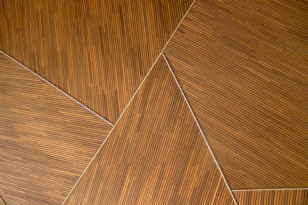 Wood paneling with small lines and larger diagonal breaks