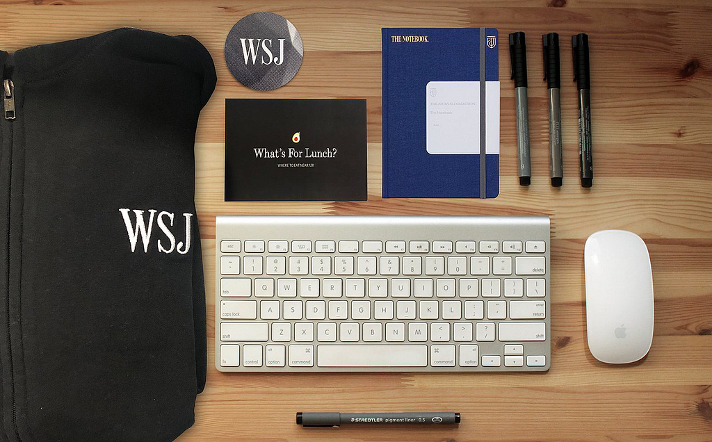 Photo of WSJ swag including t-shirt, pens, stickers