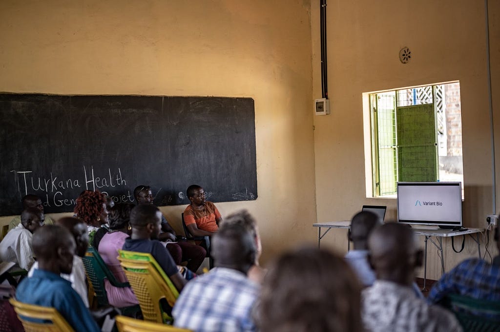 Community leaders watching a video about the study.