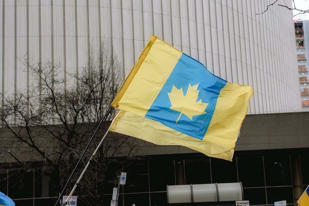 Photo by Harrison Haines: https://www.pexels.com/photo/canada-flag-in-ukrainian-colors-11325544/