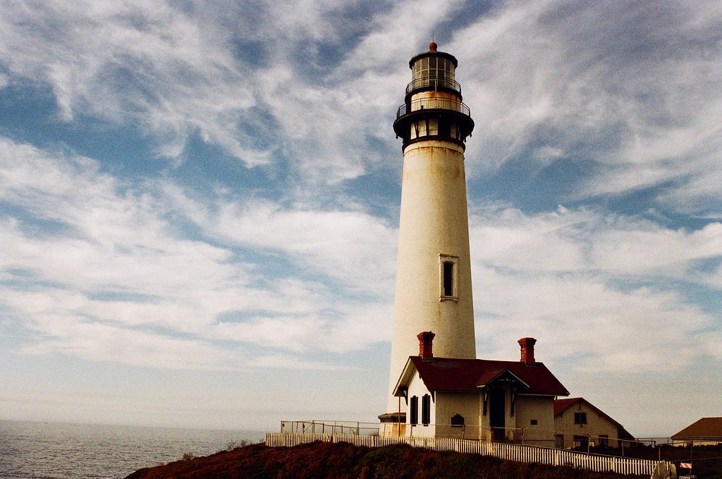 A lighthouse on a hill