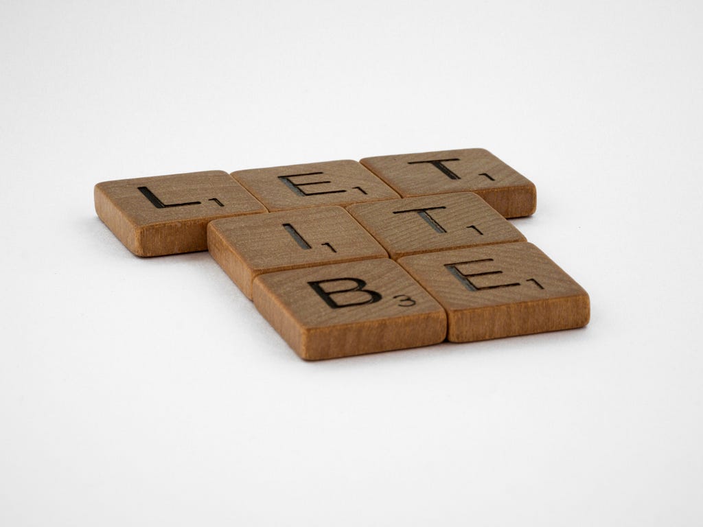 scrabble pieces spell” “Let it be”