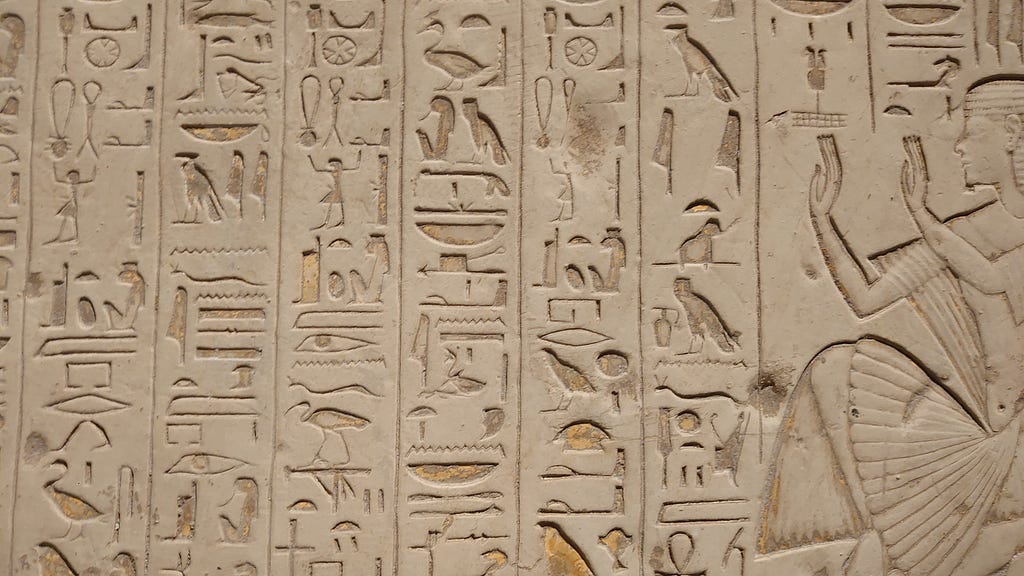 An image of hieroglyphs engraved on a wall