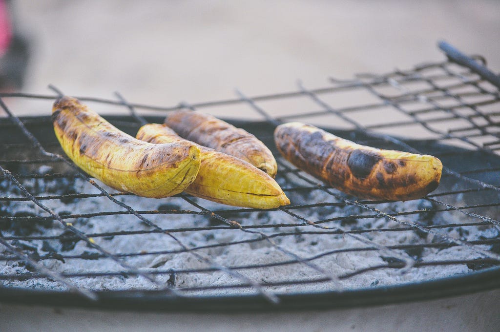Plantains being slowly grilled.