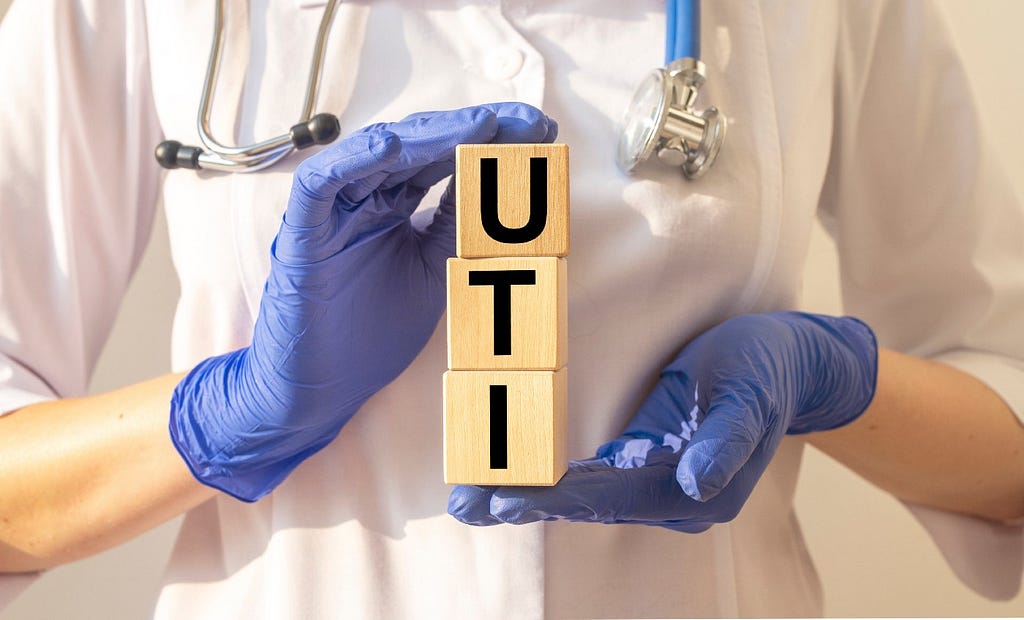 Doctor identifying urinary tract infection (UTI) symptoms and prevention strategies