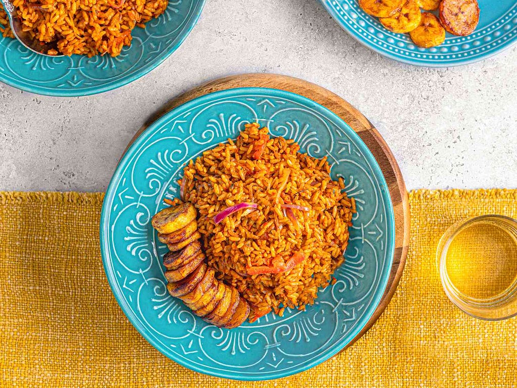 african jollof rice served on a blue dish ready for eating