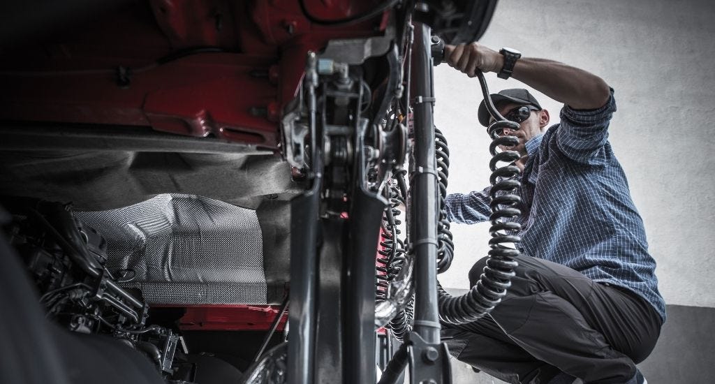 Entrepreneur inspecting semi truck