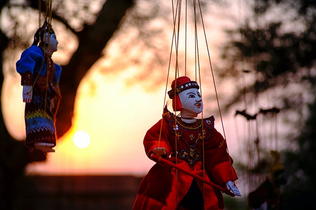 Puppet hanging in sunset
