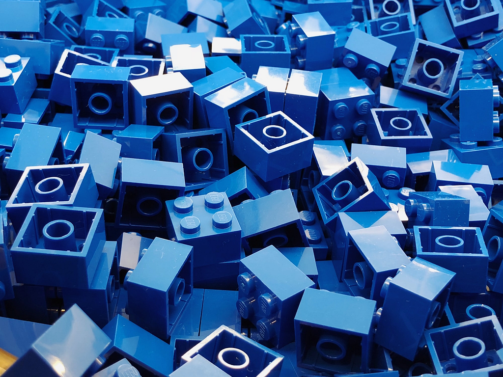 Image of Blue lego bricks in a pile — Photo by Ryan Quintal / Unsplash