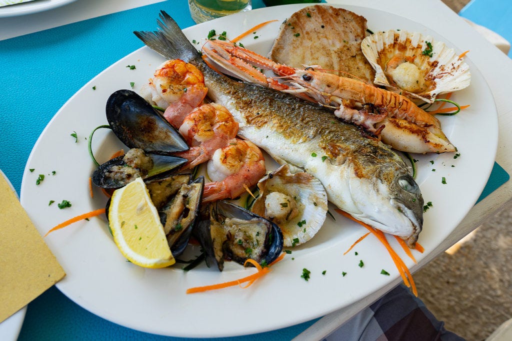 Seafood fish platter in Valun Cres island Croatia with tuna fish shrimps and mussels